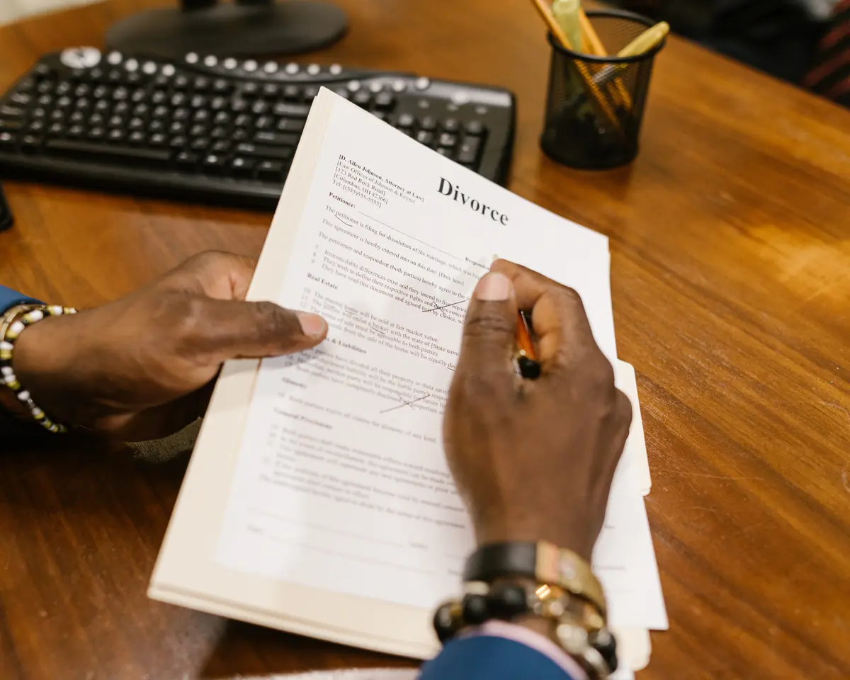 Hands reviewing personal legal documents